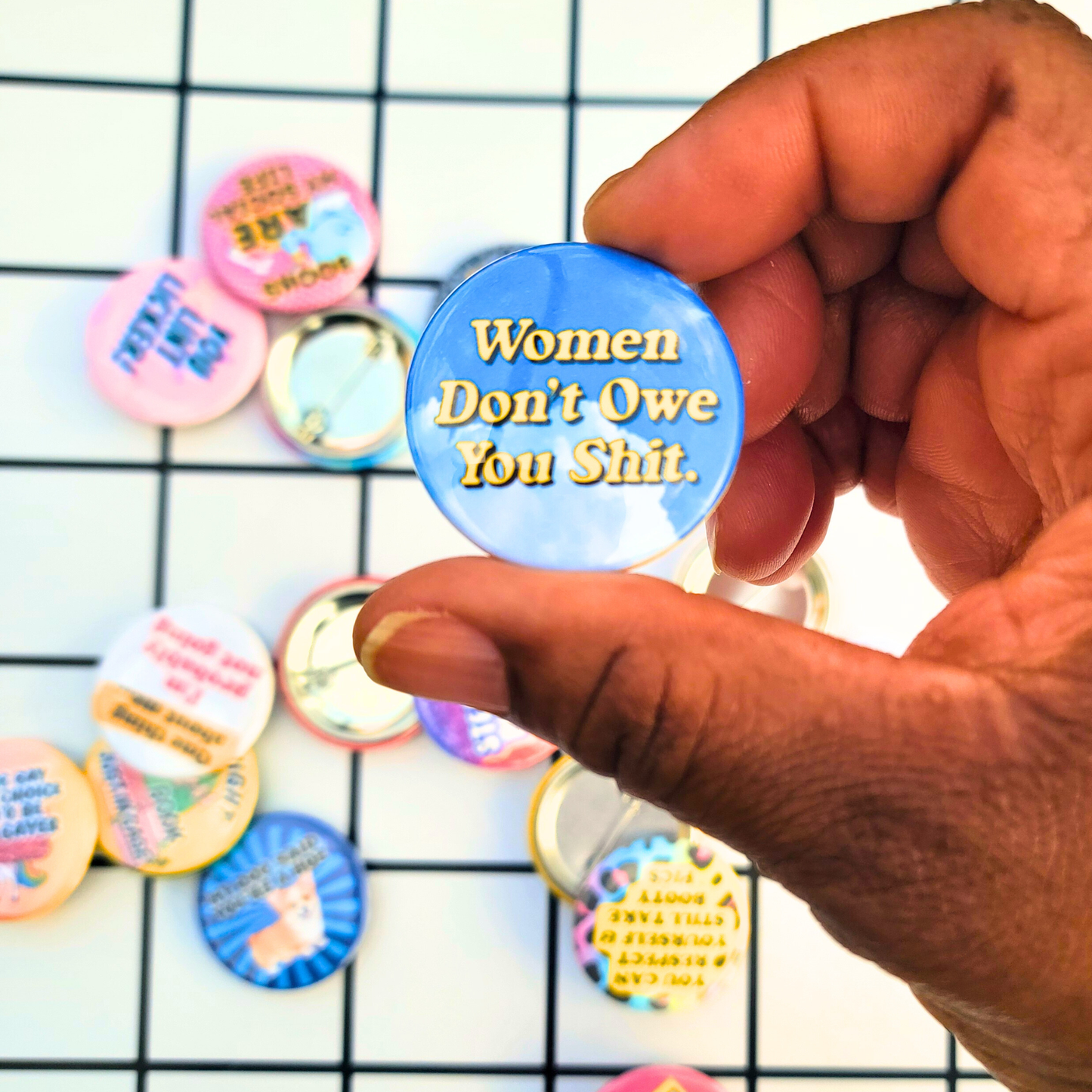 WOMEN DON'T OWE YOU SHIT BUTTON