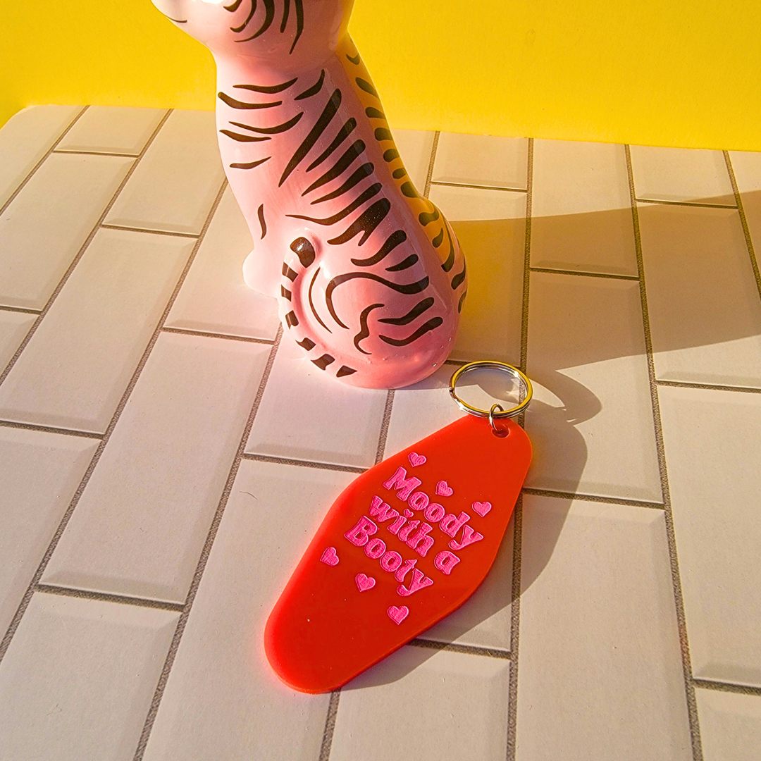 MOODY WITH A BOOTY KEYCHAIN